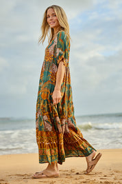 Model Maggie wearing size 10 of the Wentworth Falls Maxi Dress in colour Leopard, from the front, showing the whole outfit