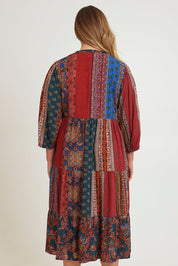 Model Chanel wearing size 16 of the Empress Falls Midi Dress in colour Jumble, from the back