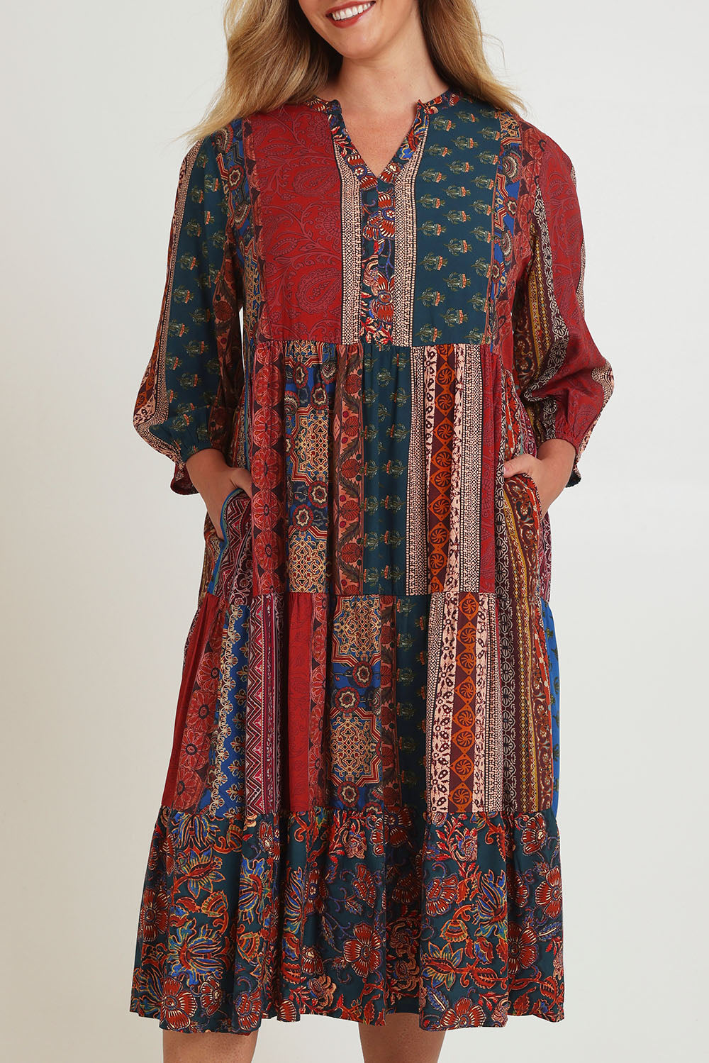 Model Chanel wearing size 16 of the Empress Falls Midi Dress in colour Jumble, from the front, cropped image