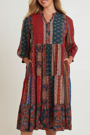 Model Chanel wearing size 16 of the Empress Falls Midi Dress in colour Jumble, from the front, cropped image