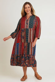 Model Chanel wearing size 16 of the Empress Falls Midi Dress in colour Jumble, from the front, showing the whole outfit
