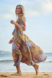 Model Maggie wearing size 10 of the Florance Falls Maxi Dress in colour Paisley, from the front, showing the whole outfit