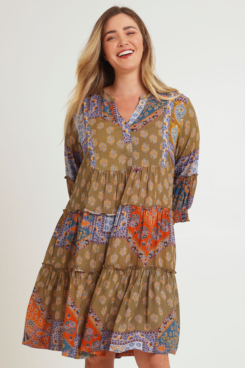 Model Chanel wearing size 16 of the Florance Falls Dress in colour Paisley, from the front, cropped image