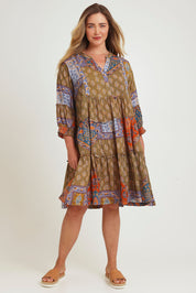 Model Chanel wearing size 16 of the Florance Falls Dress in colour Paisley, from the front, showing the whole outfit