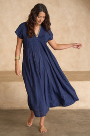 Model Tahnee wearing size 10 of the San Rafael Falls Kimono Dress in colour Deepsea (Blue), from the front, showing the whole outfit