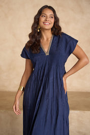 Model Tahnee wearing size 10 of the San Rafael Falls Kimono Dress in colour Deepsea (Blue), from the front, showing the whole outfit
