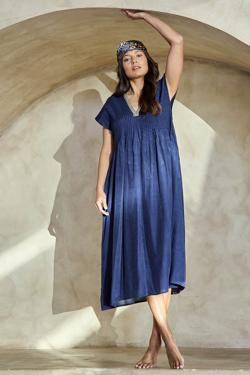 Model Tahneei wearing size 10 of the San Rafael Falls Kimono Dress – Deepsea in colour Deepsea, from the front