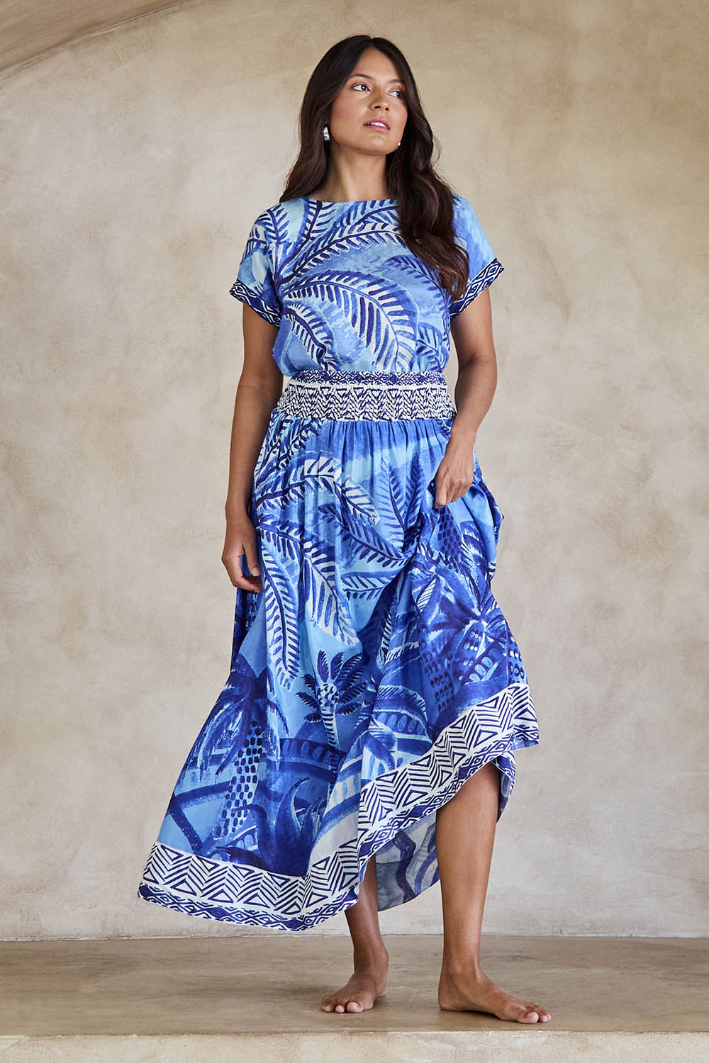 Model Tahneei wearing size 10 of the Palm Cove Long Skirt – Blue in colour Blue, from the front