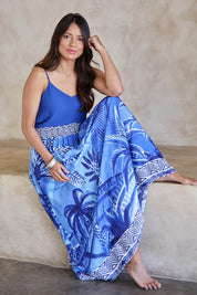 Model Tahneei wearing size 10 of the Palm Cove Long Skirt – Blue in colour Blue, from the front