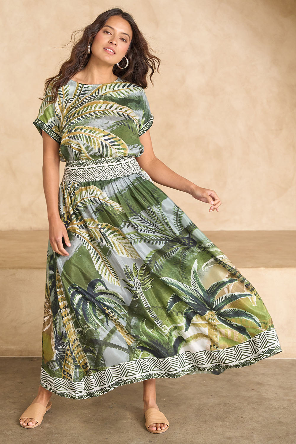 Model Tahnee wearing size 10 of the Palm Cove Long Skirt in colour Tropical (Green), from the front, showing the whole outfit