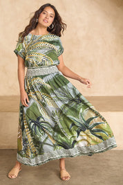 Model Tahnee wearing size 10 of the Palm Cove Long Skirt in colour Tropical (Green), from the front, showing the whole outfit