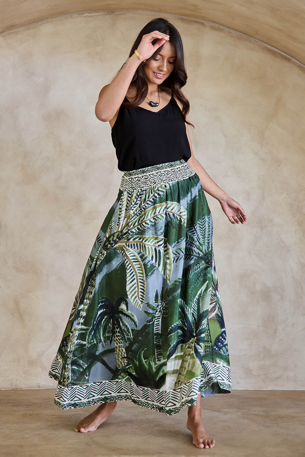Model Tahneei wearing size 10 of the Palm Cove Long Skirt – Tropical in colour Tropical, from the front