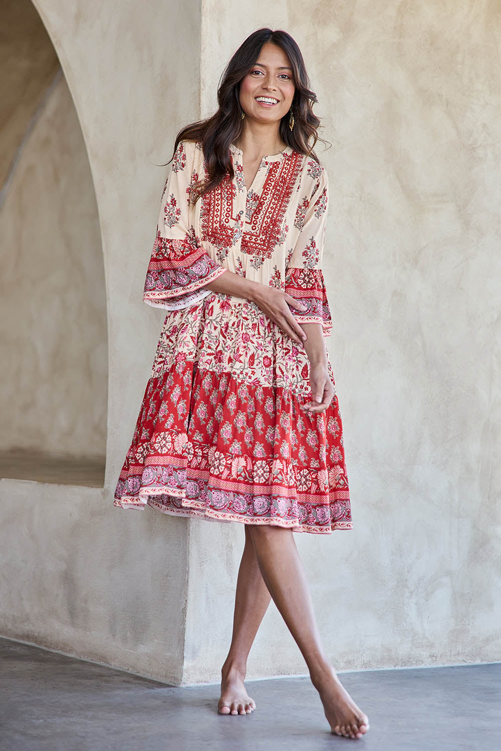 Model Tahneei wearing size 10 of the Blue Lagoon Embroidered Dress – Redcream in colour Redcream, from the front