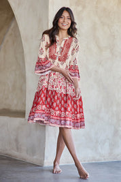 Model Tahneei wearing size 10 of the Blue Lagoon Embroidered Dress – Redcream in colour Redcream, from the front