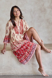 Model Tahneei wearing size 10 of the Blue Lagoon Embroidered Dress – Redcream in colour Redcream, from the front