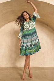 Model Tahnee wearing size 10 of the Angel Falls Dress in colour Green (Green), from the front, showing the whole outfit