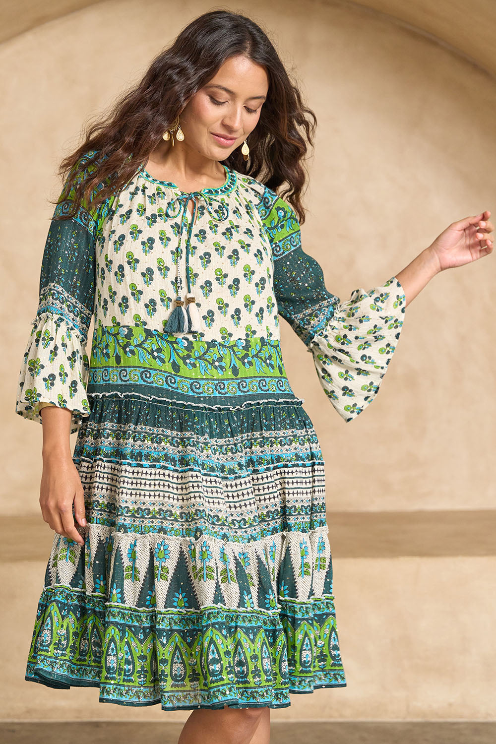 Model Tahnee wearing size 10 of the Angel Falls Dress in colour Green (Green), from the front, showing the whole outfit