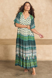 Model Tahnee wearing size 10 of the Angel Falls Long Dress in colour Green (Green), from the front, showing the whole outfit