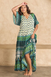 Model Tahnee wearing size 10 of the Angel Falls Long Dress in colour Green (Green), from the front, showing the whole outfit