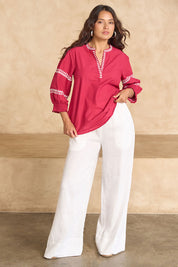 Model Tahnee wearing size 10 of the Magdelena River Cotton Blouse in colour Rosebud (Pink), from the front, showing the whole outfit