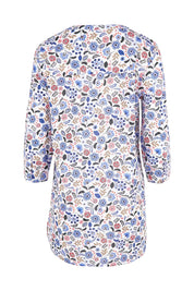 Product shot of the Adventurier Tunic in colour Floral (White), from the back