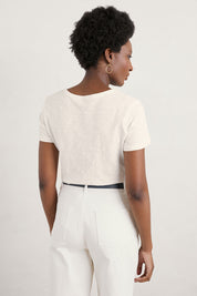 A model wearing the Printing Ink Tin colourShirt - Tiledflora (White), from the back