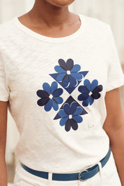 A model wearing the Printing Ink Tin colourShirt - Tiledflora (White), from the front, cropped image