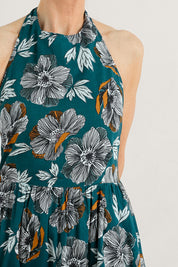 A model wearing the Summer Soul Dress in colour Peony (Green), from the front, cropped image