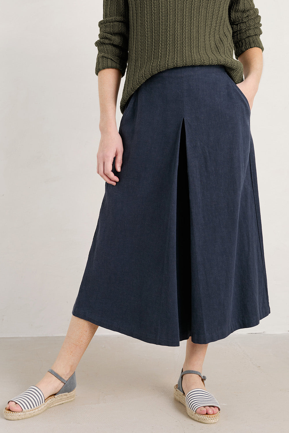 A model wearing the Intertidal Culottes in colour Maritime (Blue), from the front, cropped image
