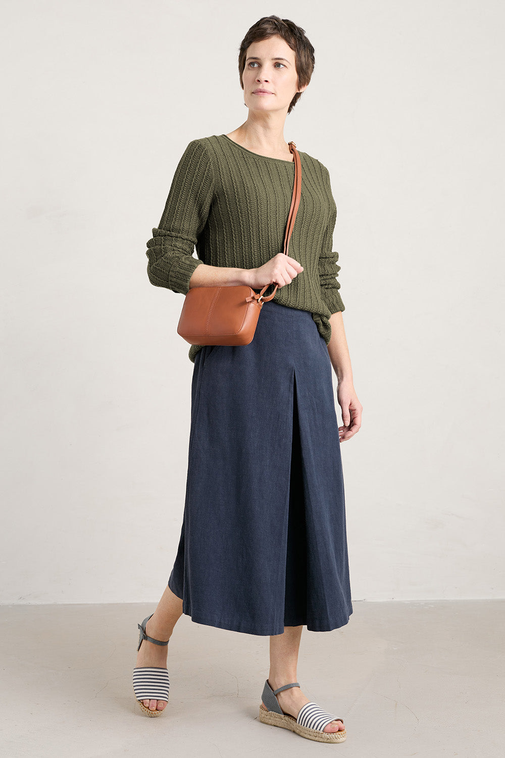 A model wearing the Intertidal Culottes in colour Maritime (Blue), from the front, showing the whole outfit