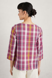 A model wearing the Riding High Top in colour Clover (Pink), from the back