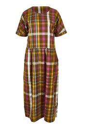 Product shot of the Brouse Dress in colour Clover (Green), from the front