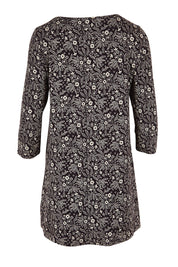 Product shot of the Arusha Tunic in colour Leaves (Black), from the back