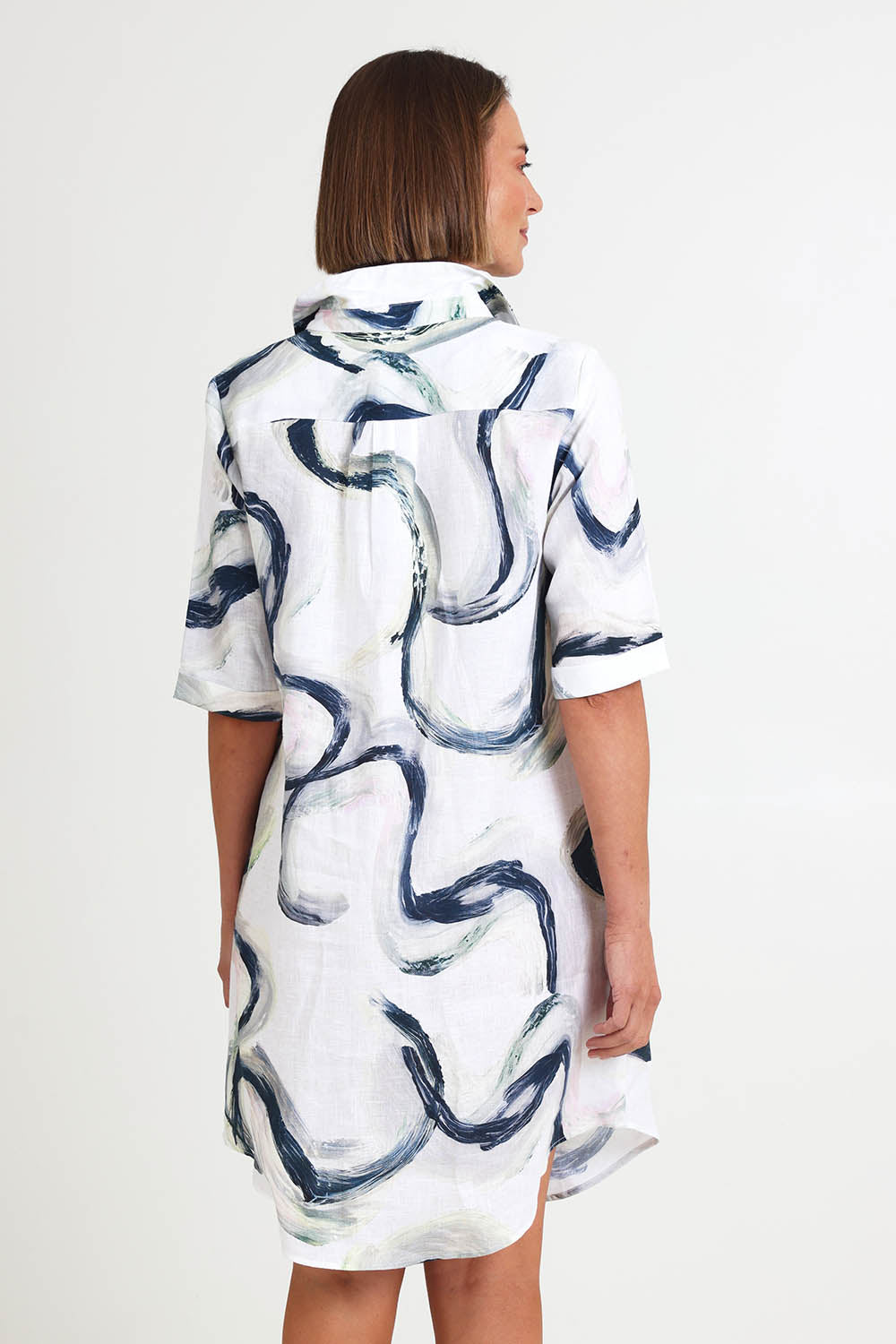 Model Riinar wearing size 10 of the Riverstone Shirtmaker Dress – Riverstone in colour Riverstone, from an angle