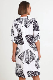 Model Riinar wearing size 10 of the Shell Button Front Dress – Shell in colour Shell, from the back