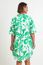 Model Riinar wearing size 10 of the Garden Shirtmaker Dress – Emerald in colour Emerald, from the back