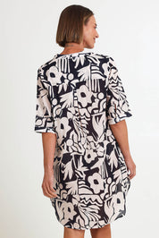 Model Riinar wearing size 10 of the Bloom Shirtmaker Dress – Midnight in colour Midnight, from an angle