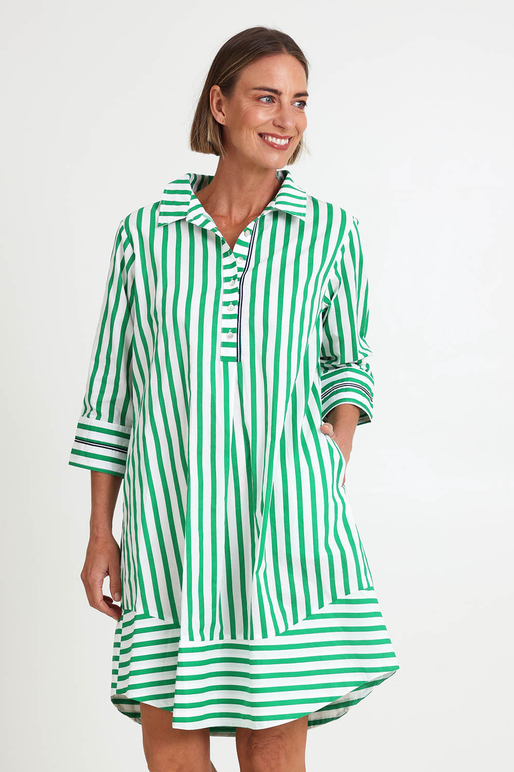 Model Riinar wearing size 10 of the 2 Way Stripe Dress – Green in colour Green, in a cropped view