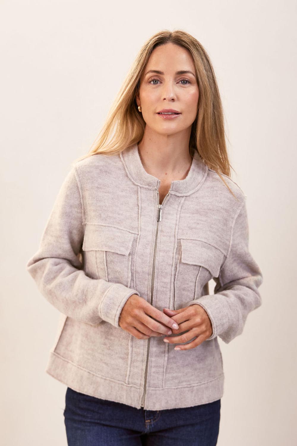 A model wearing the Bomber Zip Boiled Wool Jacket in colour Natural, from the front, cropped image