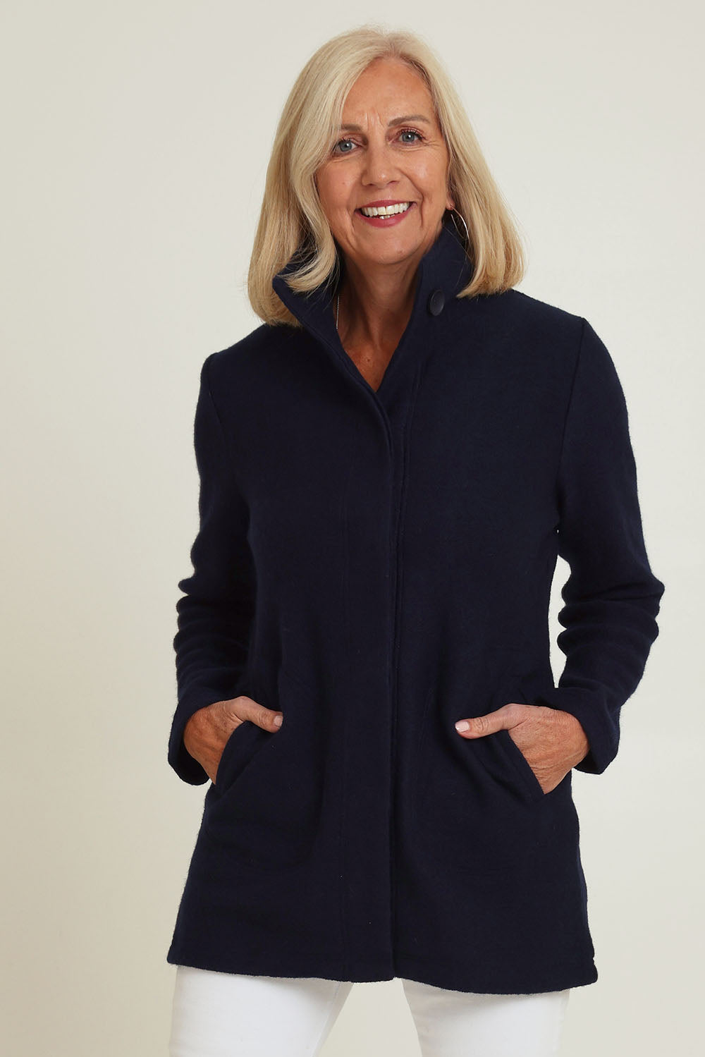 Model Sandy wearing size S of the Funnel Neck Boiled Wool Coat in colour Navy (Blue), from the front, cropped image