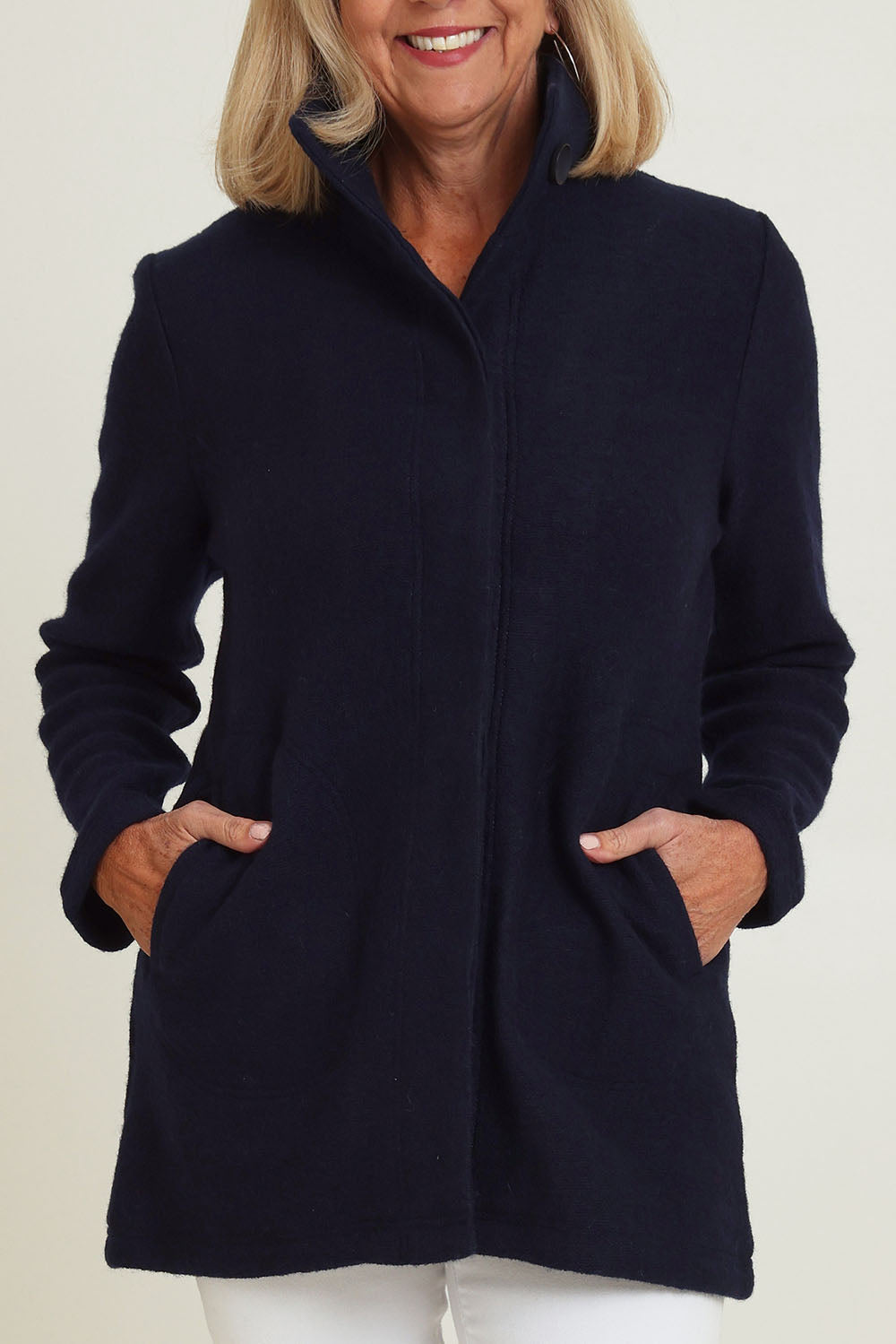 Model Sandy wearing size S of the Funnel Neck Boiled Wool Coat in colour Navy (Blue), from the front, cropped image