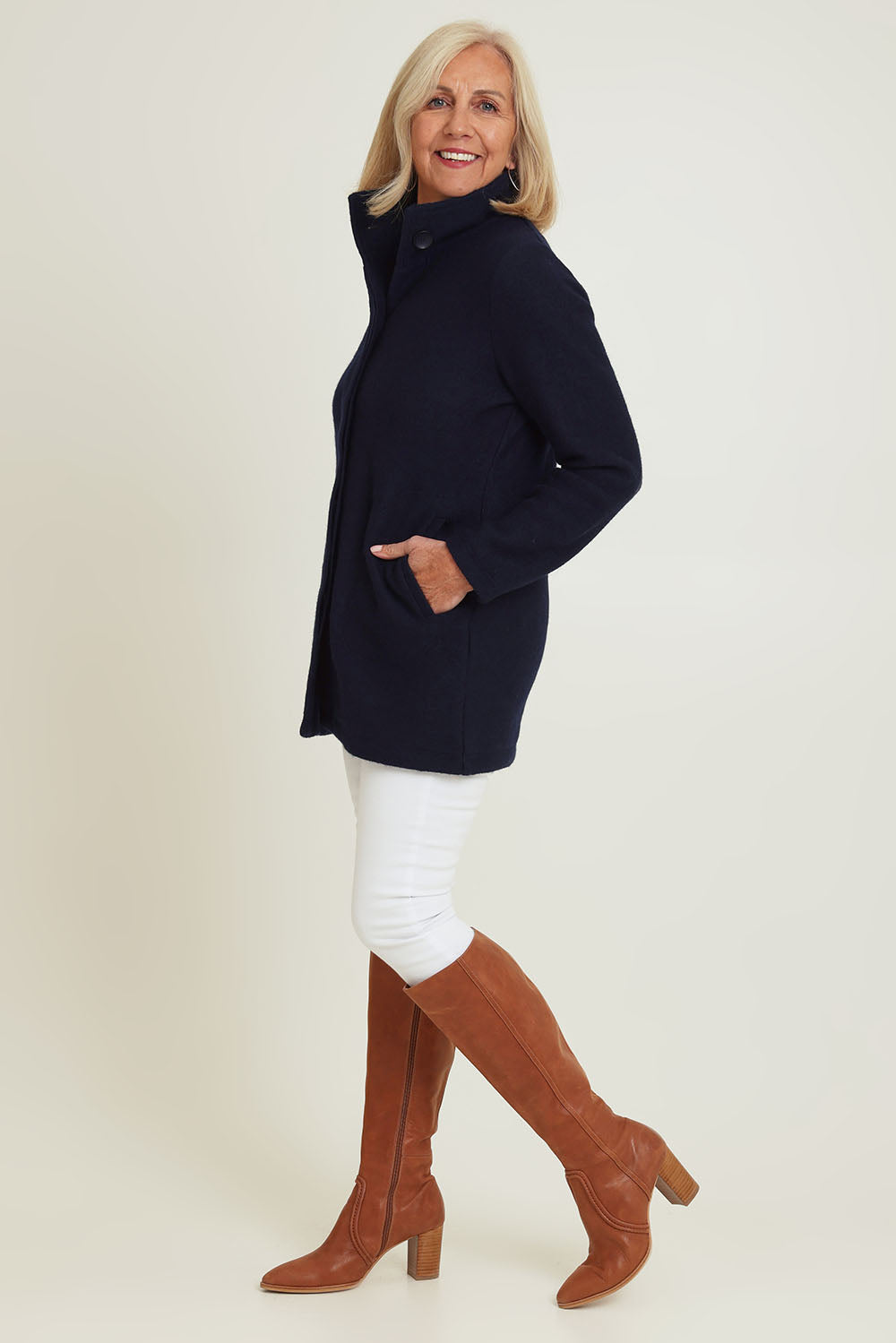 Model Sandy wearing size S of the Funnel Neck Boiled Wool Coat in colour Navy (Blue), from the front, showing the whole outfit