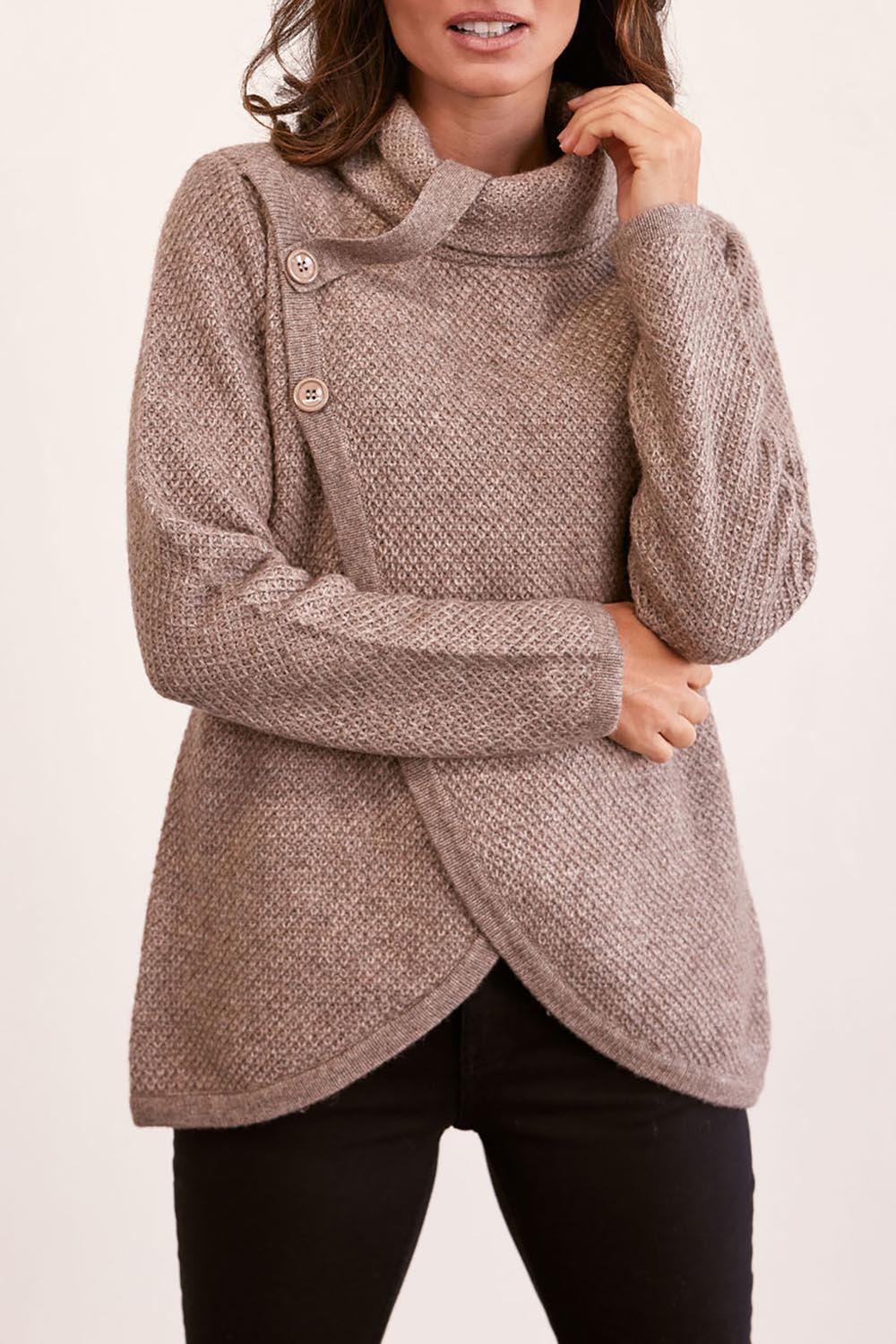 A model wearing the Moss Stitch Cowl Wool Sweater in colour Mocha, from the front, cropped image