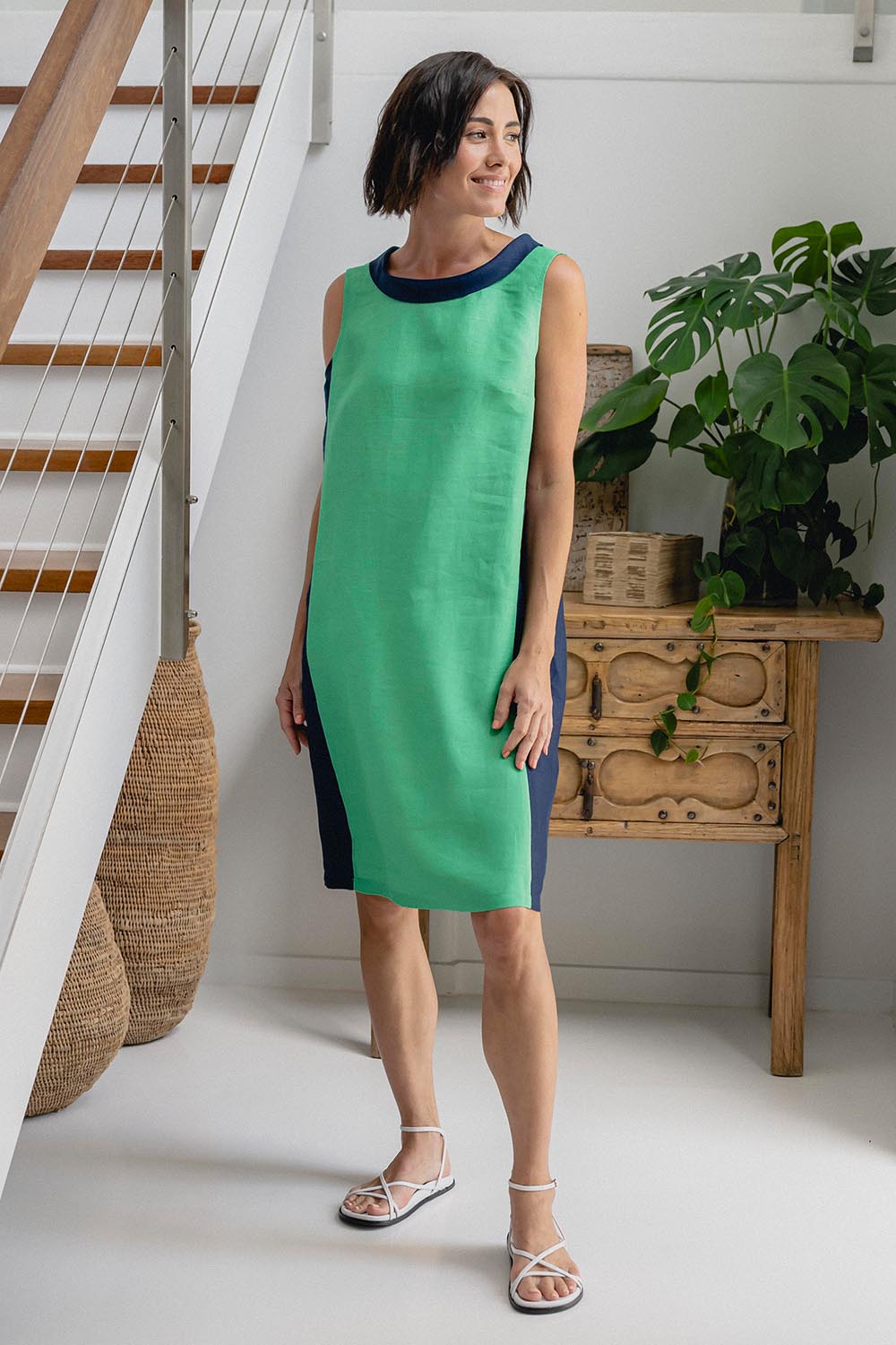A model wearing the Sl Cowl Neck Splice Shift Linen Dress in colour Greennavy (Green), from the front, showing the whole outfit