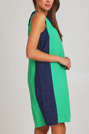 Model Madeline wearing size 10 of the Sl Cowl Neck Splice Shift Linen Dress in colour Greennavy (Green), from the front, cropped image