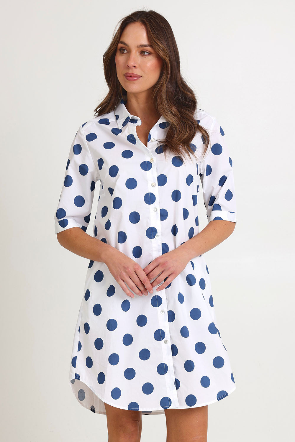 Model Madeline wearing size 10 of the Denim Spot Cotton Shirtmaker Dress in colour Denimspot (Blue), from the front, cropped image