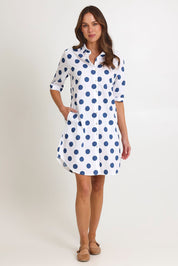 Model Madeline wearing size 10 of the Denim Spot Cotton Shirtmaker Dress in colour Denimspot (Blue), from the front, showing the whole outfit