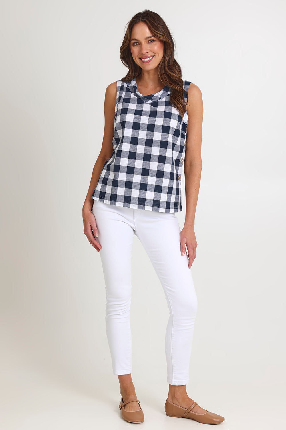 Model Madeline wearing size 10 of the Cowl Neck Cotton Top in colour Navy (Blue), from the front, showing the whole outfit