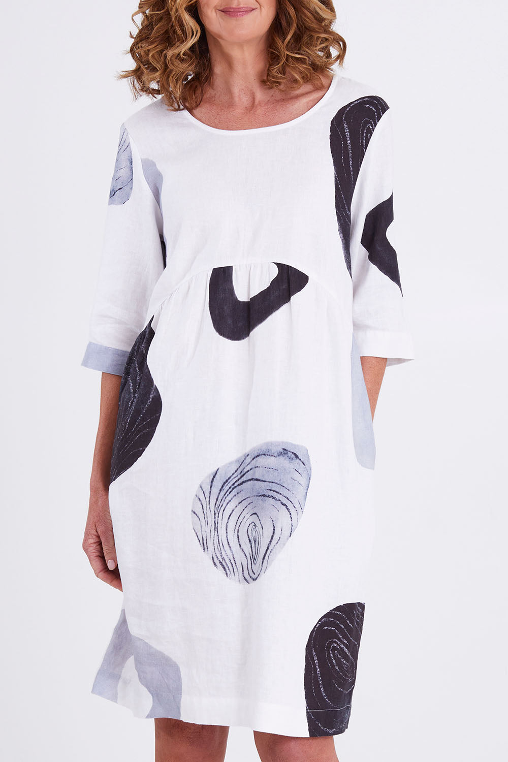 Model Emma wearing size 10 of the Linen 3/4 Sleeve Dress in colour Achromatic (White), from the front, cropped image