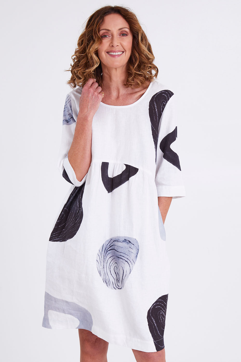 Model Emma wearing size 10 of the Linen 3/4 Sleeve Dress in colour Achromatic (White), from the front, cropped image